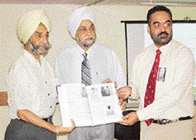 Dr A.S. Sekhon, Principal, Adesh Medical College, Bathinda, and Mr Jugdip Singh, Director, SPS Apollo Hospitals, release a book on shoulder examination, edited by Dr H.S. Gill, in Ludhiana
