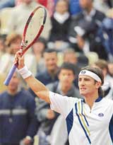 Tommy Robredo of Spain celebrates after beating Ilia Bozoljac of Serbia & Montenegro in the second round of the French Open at Roland Garros in Paris on Thursday