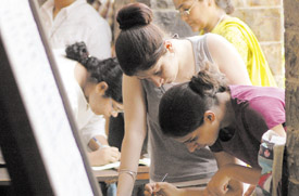 Students fill their admission forms at St Stephens College in the Capital on Friday