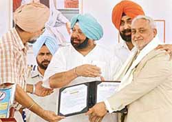 The Punjab Chief Minister, Capt Amarinder Singh, felicitates Dr A.S. Bindra in recognition of his services in promoting meat products, at the inauguration of Guru Angad Dev Veterinary and Animal Sciences University in Ludhiana on Friday. 