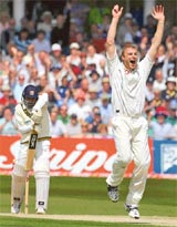 Englands Andrew Flintoff celebrates after taking the wicket of Sri Lankas Mahela Jayawardene during the first day of their third Test in Trent Bridge