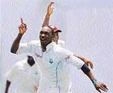 Dwayne Bravo of the West Indies celebrates after dismissing V.V.S Laxman during the first Test in St. Johns on Friday
