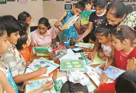 Students of Mt Carmel School busy painting. 