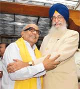 Tamil Nadu Governor Surjit Singh Barnala greets Chief Minister M. Karunanidhi on his 83rd birthday in Chennai on Saturday