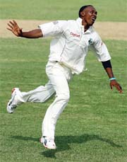 West Indies Dwayne Bravo celebrates after taking the wicket of Mohammad Kaif on the first day of the first Test in St. Johns