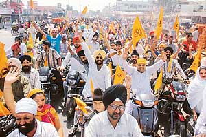Sikhs take out a religious procession to commemorate the martyrdom of Guru Arjan Dev in Ambala on Sunday.