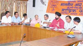 Mr R.P Singh, member of the national executive of the BJP, presides over a meeting of BJP workers in Ludhiana