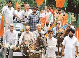BJP workers protesting against the hike in petrol and diesel prices in Sector 33
