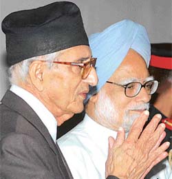 Nepal Prime Minister Gijra Prasad Koirala is welcomed by Prime Minister Manmohan Singh at Indira Gandhi airport in New Delhi