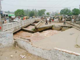 The collapsed bridge on the Sidhwan canal on the Gill road, construction of which is long over due