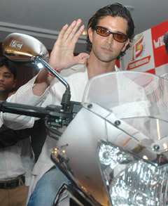 Bollywood star and Hero Honda brand ambassador Hrithik Roshan sits on the 15 millionth bike