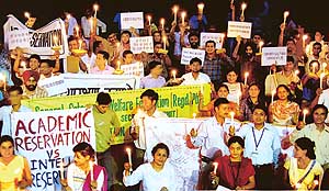 Medicos hold a candlelight procession in protest against the reservation policy in Chandigarh on Saturday. 