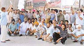 Members of auto-rickshaw union stage protest in Ludhiana