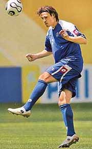 Serbia and Montenegros forward and team captain Savo Milosevic plays with the ball during a training session in Leipzig on Saturday. 