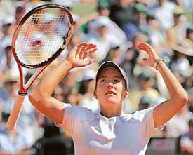 Justine Henin-Hardenne of Belgium celebrates after defeating Russian Svetlana Kuznetsova in the French Open final at Roland Garros in Paris on Saturday. Henin-Hardenne won 6-4, 6-4.