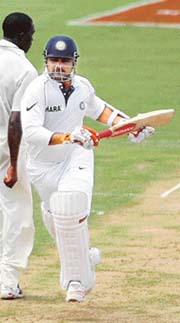 Virender Sehwag takes a run on the first day of the second Test in St. Lucia on Saturday. 