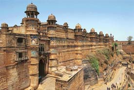 Gwalior Fort: The great eastern faade of the Man Mandir Palace in the fort has high, flat, unpierced and highly decorative walls, punctuated by massive round towers which act as reinforcing buttresses