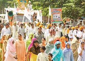 RJD workers participate in a shobha yatra organised on the occasion of Sant Kabir Jayanti in Chandigarh on Sunday.