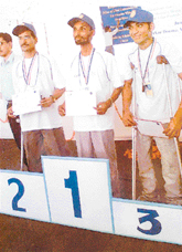 Surjeet Singh (right), who bagged the third position in the Socket-making competition in the North Zone Abilympics, being honoured in Delhi. 