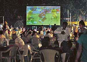 WE LOVE FOOTBALL ! With soccer mania gripping the world, Ludhianvis, apparently bitten by the bug, enjoy the World Cup on a giant screen over dinner at a club in the city on Saturday.