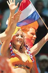 A Dutch supporter holds her national flag  prior to the match between Serbia and Montenegro  and Netherlands at Leipzig stadium on Sunday.