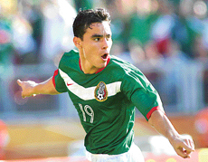 Mexican forward Omar Bravo celebrates after scoring the first goal against Iran during their Group D match in Nuremberg on Sunday.