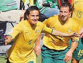 Australias Tim Cahill celebrates with a team-mate after scoring his second goal against Japan in their Group F World Cup football match in Kaiserslautern