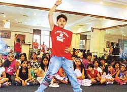 a boy dances to the tune of music at a summer workshop held in Sutlej Club, Ludhiana, on Wednesday.