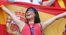A Spanish supporter holds her national flag during a Group H game between Spain and Ukraine at Leipzig stadium