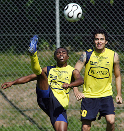 Ecuadorean midfielder Christian Lara (left) kicks the ball as forward Ivan Kaviedes looks on in Bad Kissinngen on Monday. 