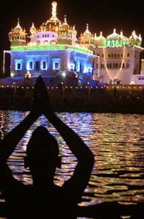 A devotee pays obeisance at the illuminated Darbar Sahib at Tarn Taran ahead of Guru Arjan Devs martyrdom day, which falls on June 16.
