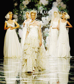 Models present gowns by Spanish designers Victorio & Lucchino at the Barcelona Fashion Week wedding dresses show in Barcelona