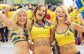 Swedish supporters cheer their team before the start of the Group B game against Paraguay in Berlin on Thursday