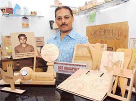 Sumeet Nayar displays his engravings. 
