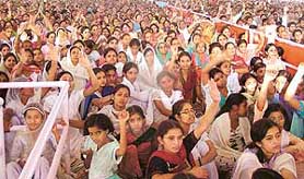 A gathering listens to Bapu Asaram’s sermon at an ashram in Seonk village.