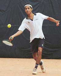 Karan Patnaik in action during a tennis championship in Chandigarh on Saturday. 