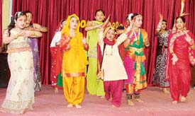 Children of the Love Dale Club perform during a summer camp here on Saturday. 
