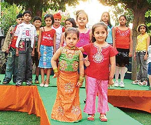 Kids of the Funtoosh Club walk on the ramp on the concluding day of the summer camp in Ludhiana on Friday.