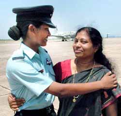 Woman pilot Kavita Kumarasen is greeted by her sister during the combined graduation passing out parade at the Air Force Academy, Hyderabad, on Saturday