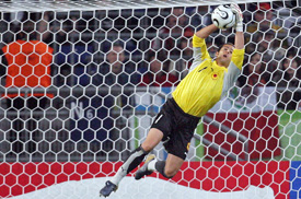 Angolan goalkeeper Joao Ricardo catches the ball during the Group D match against Mexico in Hanover on Friday. 