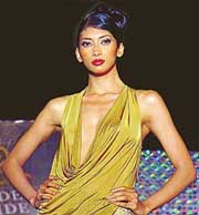 A model walks down the ramp in her swirling, whirling windy drapes