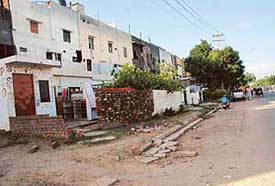 Despite encroachment in the rear of houses in Sector 30-B, the Chandigarh Administration is undertaking widening of the road