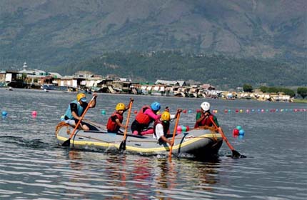 Youths take part in a boat race being organised as part of a five-day training course by the Jammu and Kashmir Tourism Department on the Dal Lake, Srinagar