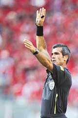Argentine poet Horacio Elizondo officiates during the World Cup