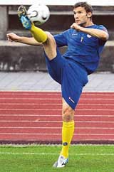Ukraines Andriy Shevchenko kicks a ball during a soccer training session in Potsdam on Friday