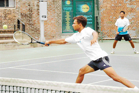 Dinesh Kumar and Varinder Patial in action in mens doubles against Shiv Bahadur and Ram Kirpal at a tennis tournament at the CLTA complex, Chandigarh, on Monday.