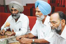 Mr Kuldip Singh, Mr Prem Singh Bhangu and Mr Chander Shekhar, members of the Punjab State Preparatory Committee, Marxist Communist Party of India (United) at a press conference at Kisan Bhavan in Sector 35, Chandigarh, on Tuesday. 