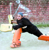 Goalkeeper Arshdeep Kaur practises fending off the balls at Nehru Gardens in Jalandhar.