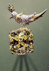 The 'Tiffany diamond bird on a rock' brooch made of ruby, gold, platinum, white and yellow diamonds, and featuring the Tiffany diamond bottom of over 128 carats,
