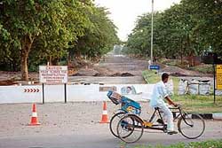 A road being repaired in Chandigarh on Wednesday. The road separating Sectors 31 and 32 will remain closed till October because of the recarpeting.